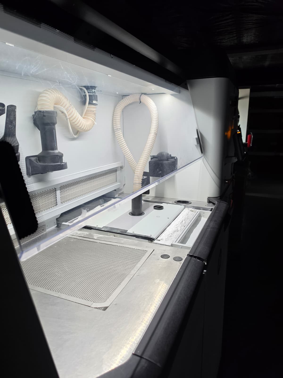 MJF processing station where finished builds are unpacked and unused nylon powder is recovered