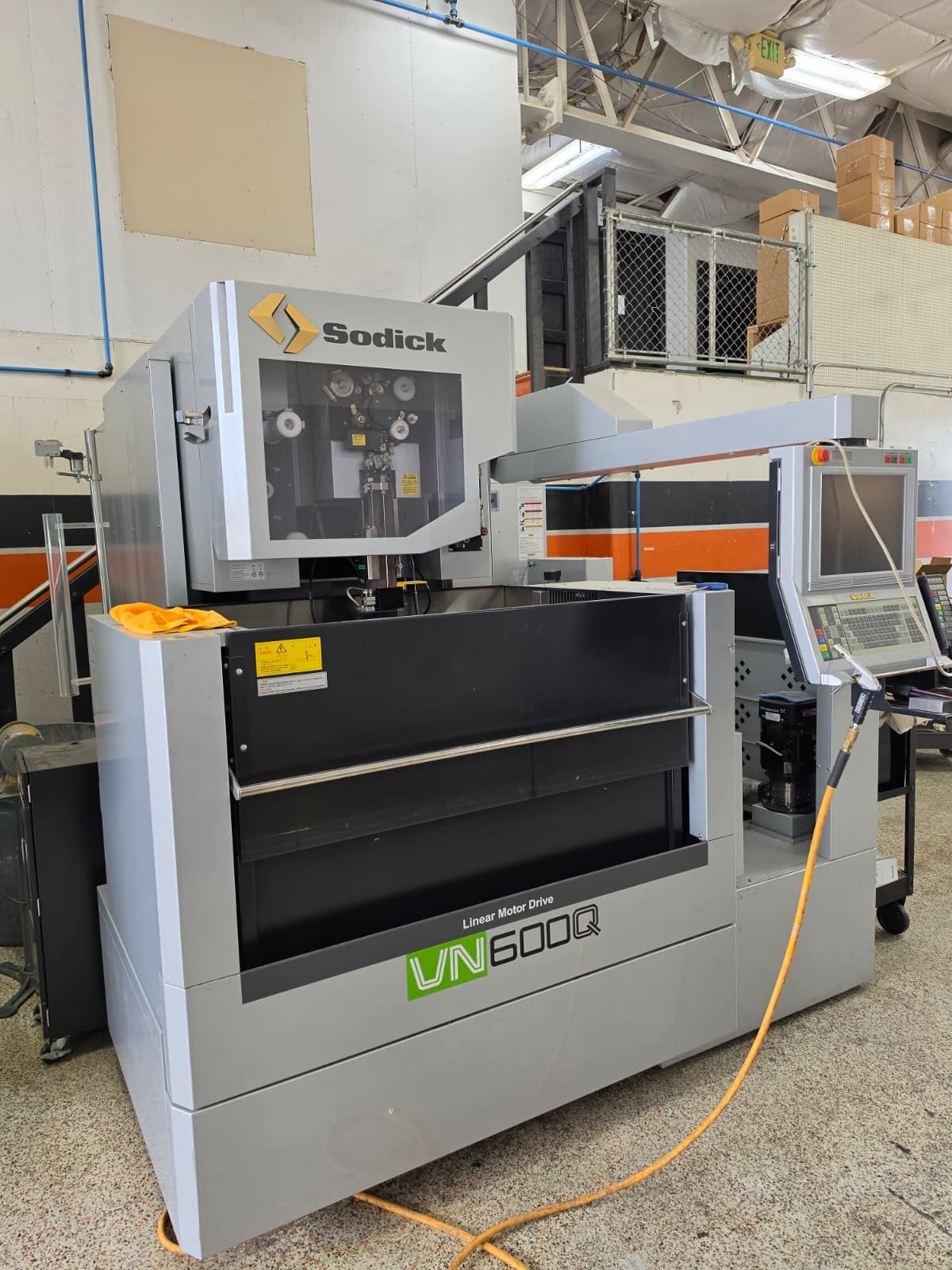 Sodick VN600Q linear motor drive wire EDM machine with wire guide head visible