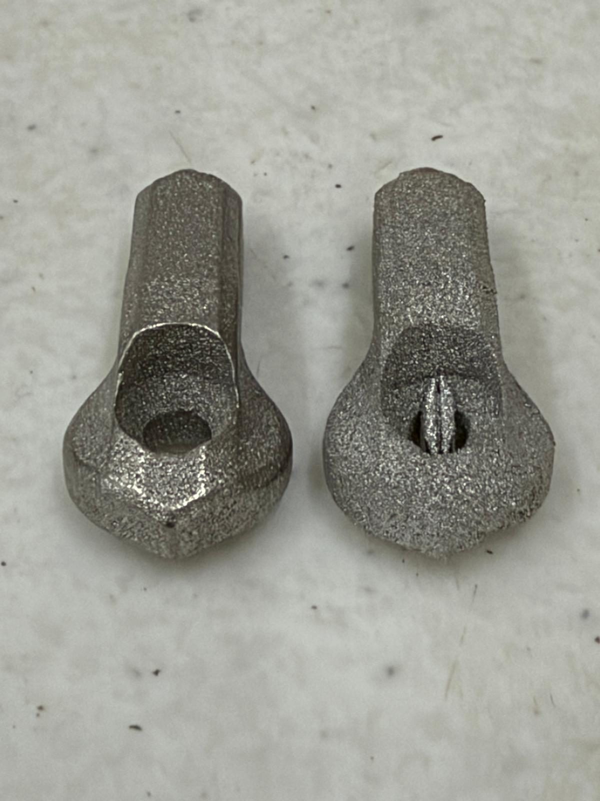 DMLS metal parts after tumbling, edges broken and the surface evened out