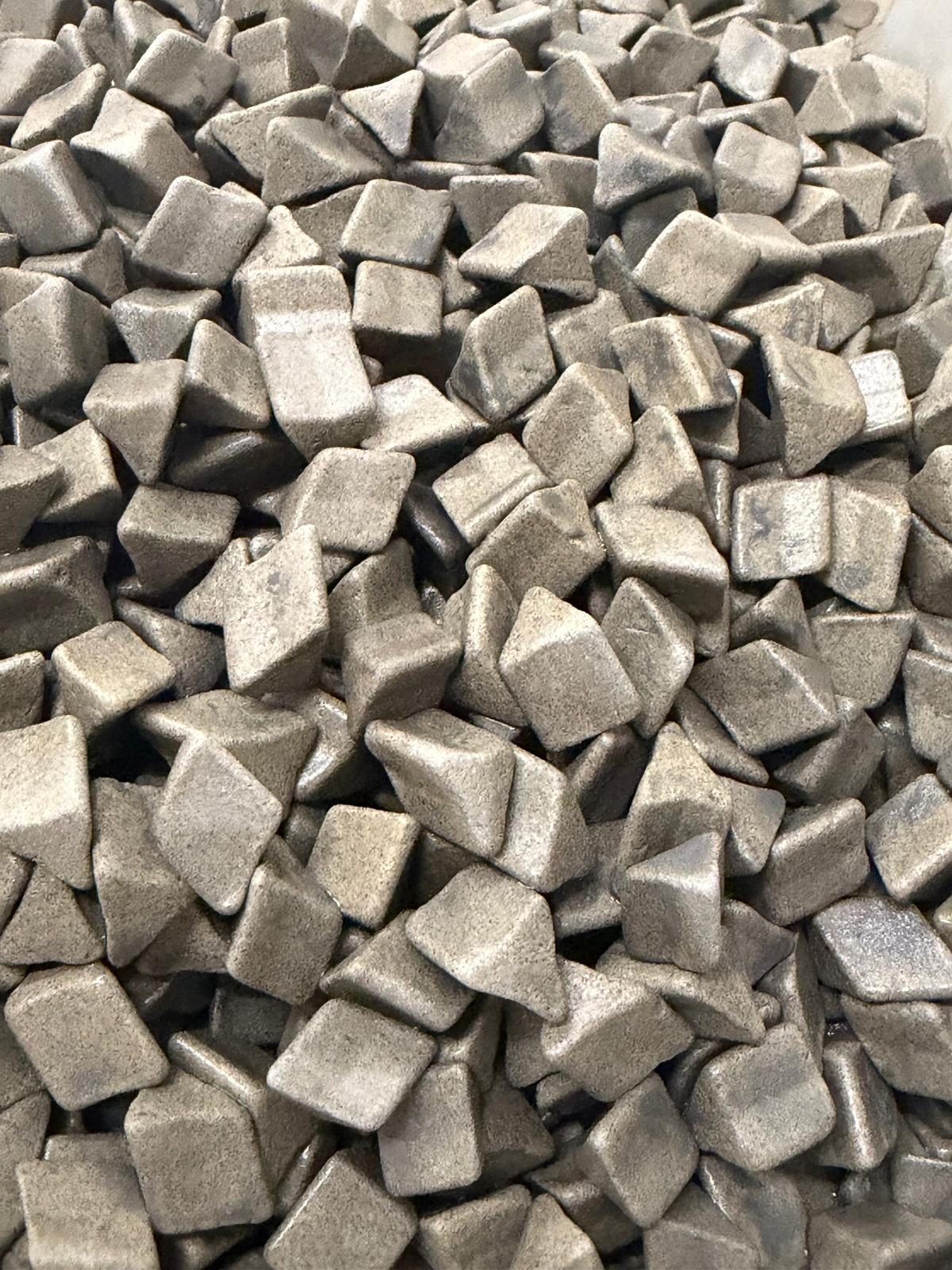 Ceramic and plastic tumbling media used to deburr printed metal parts